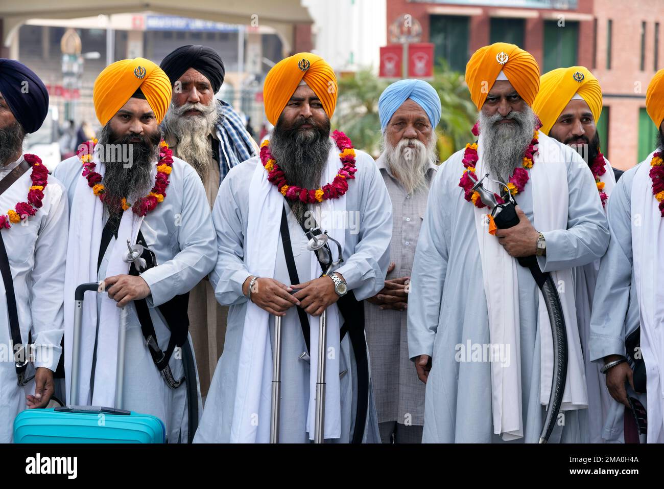 Indian Sikh Pilgrims Enter Pakistan Through The Wagah Border Crossing ...