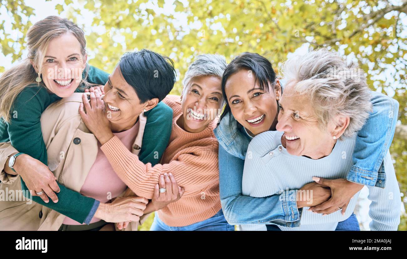 Friends, park and portrait of group of women enjoying bonding, quality time and relax in retirement together. Diversity, friendship and faces of happy Stock Photo
