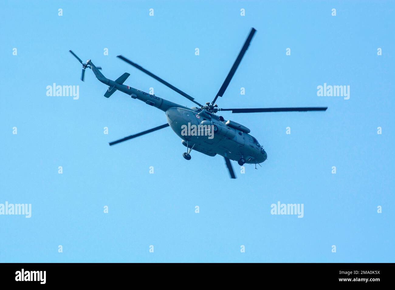 Calcutta, India - December 15, 2022: Close-up of flying chopper against isolated blue sky. Indian air force chopper. Stock Photo