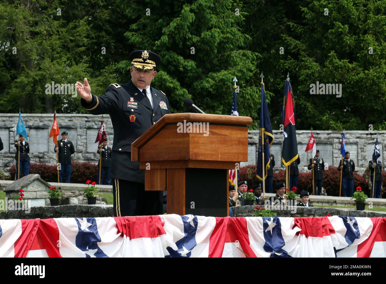 Maj. Gen. Mark McCormack, 28th Infantry Division commander, notes the addition of a Battle of the Bulge monument to the division shrine during the unit's annual memorial service at Boalsburg, Pa. May 22, 2022. The 2022 memorial service marked the return of the colorful ceremony to the grounds along Spring Creek after the coronavirus pandemic canceled the event in 2020 and forced a scaled-down ceremony in 2021. U.S. Army photo by Master Sgt. Doug Roles Stock Photo