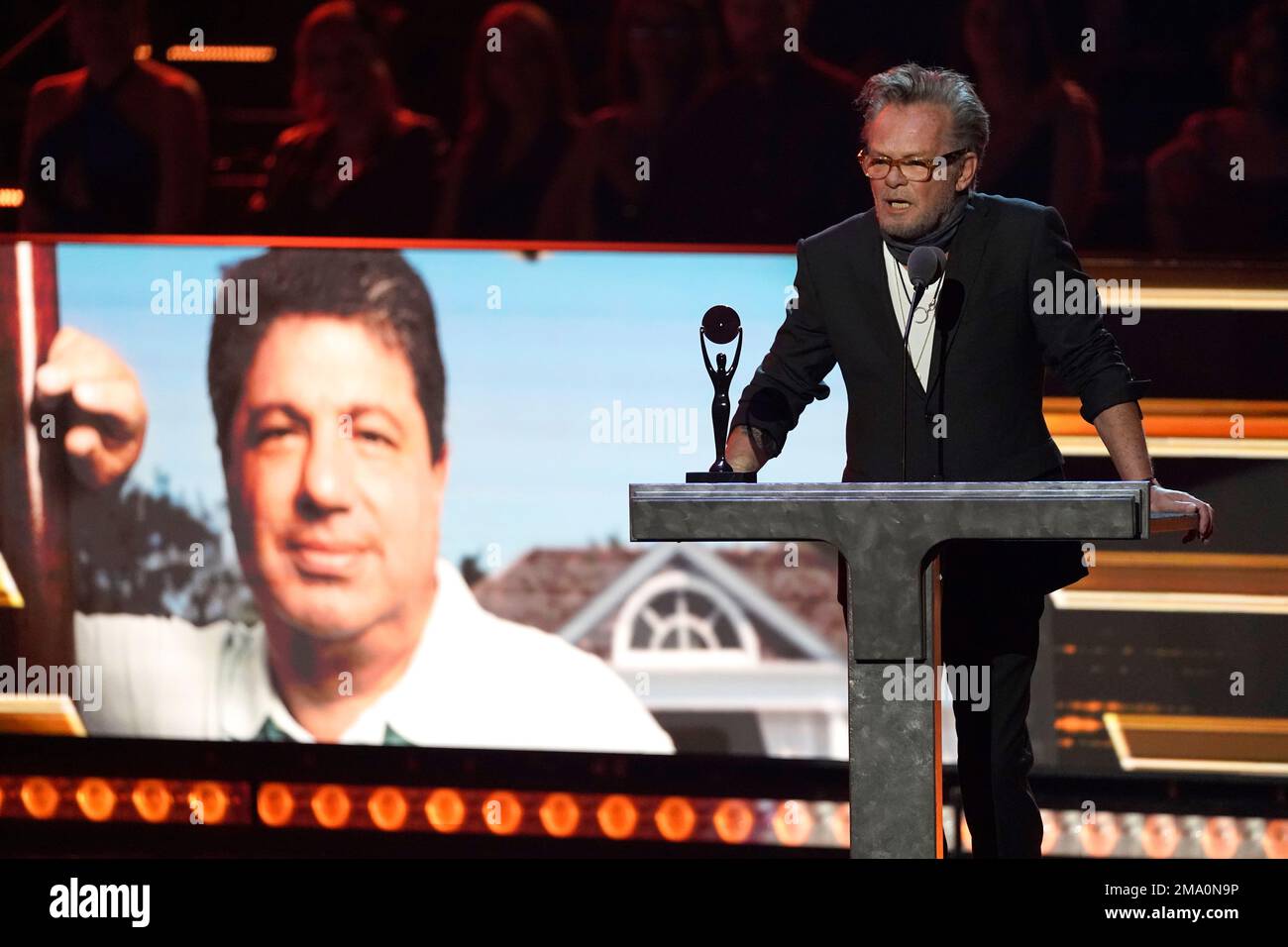 John Mellencamp introduces inductee Allen Grubman during the Rock