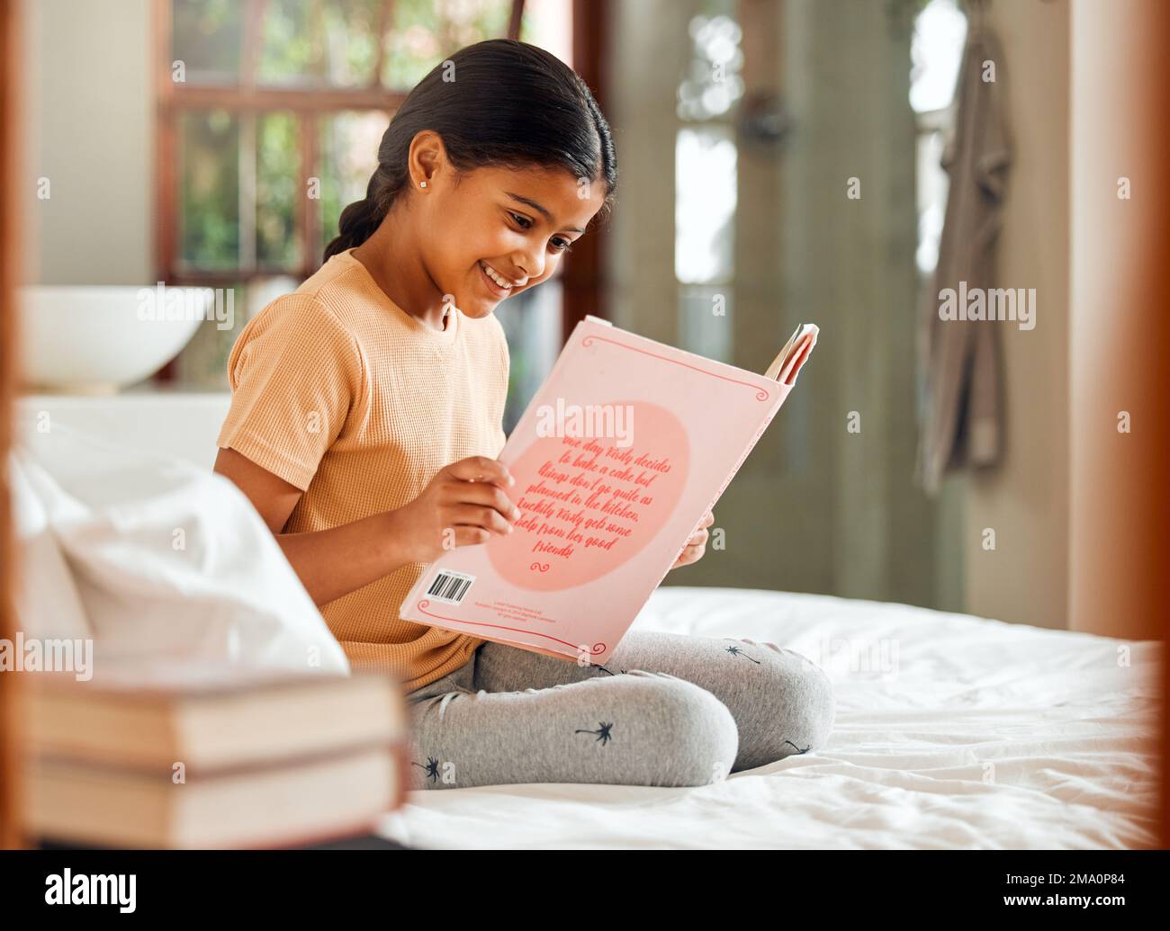 Child or girl reading for home learning, story and language education