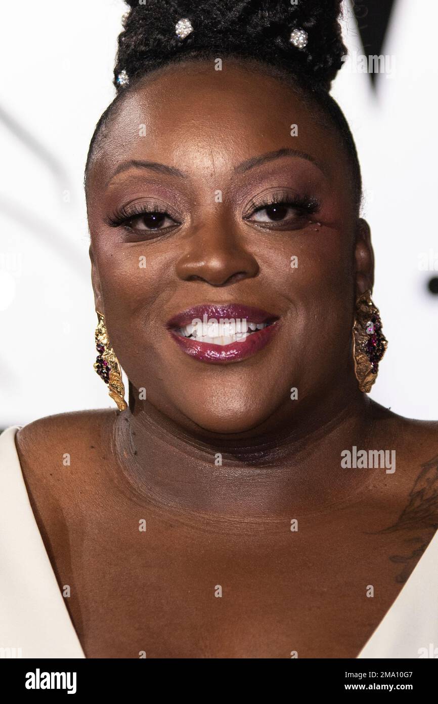 Judi Love poses for photographers upon arrival for the premiere of the