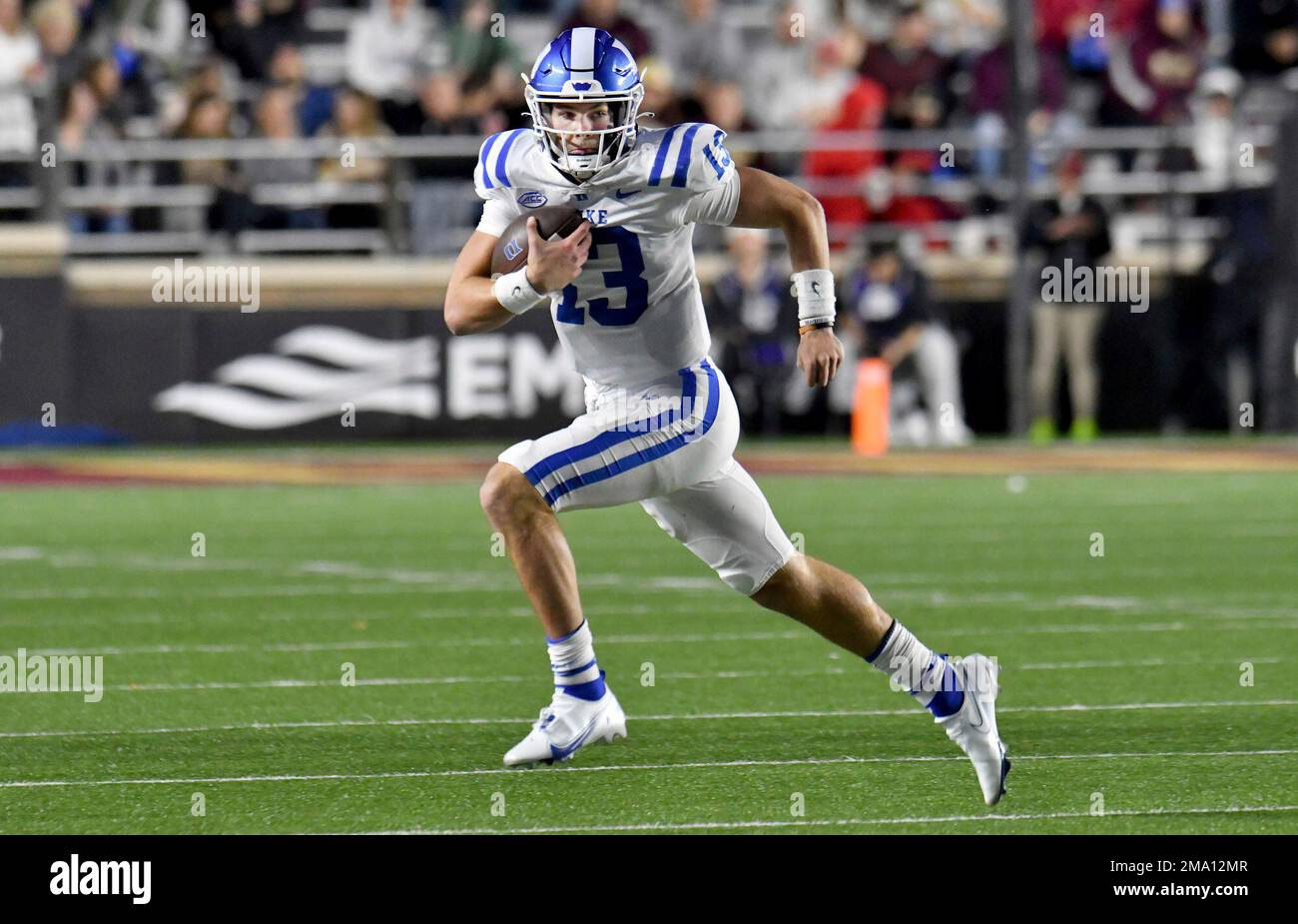 Duke quarterback Leonard Riley runs with the ball during the first half