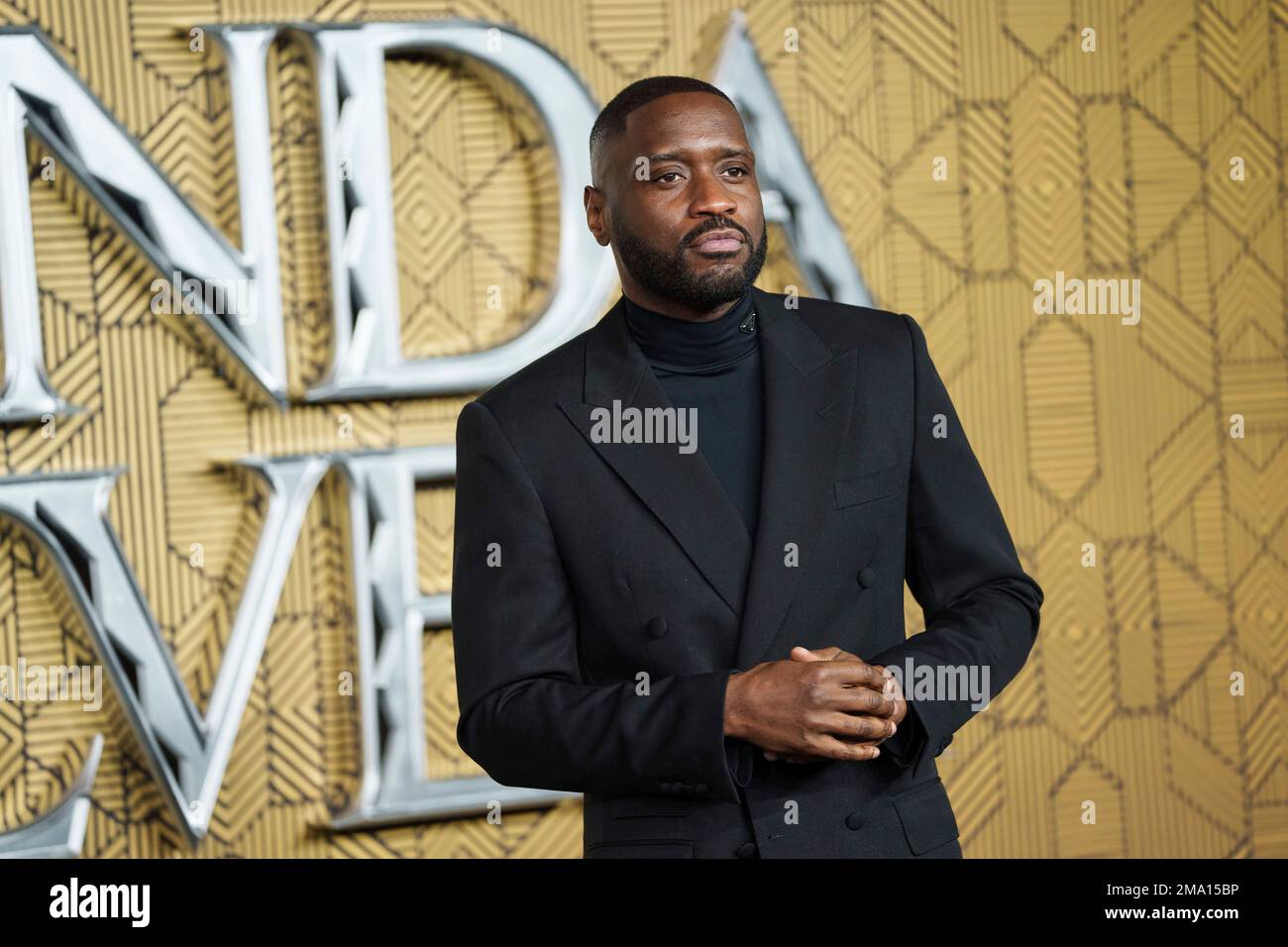 Lethal Bizzle poses for photographers upon arrival for the premiere of