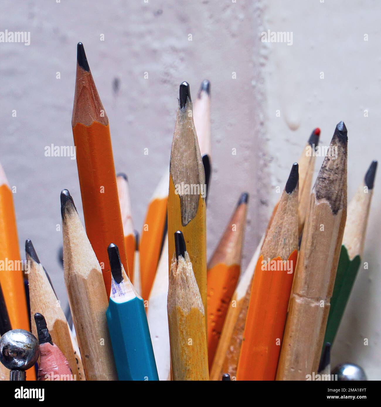 Different pencils in a jar on the table. Selective focus Stock Photo