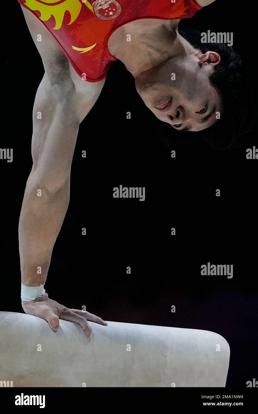 Boheng Zhang of China competes on the pommel horse at the Men's Team