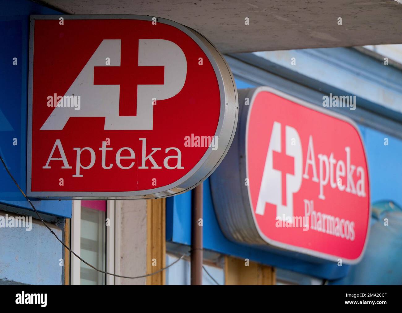 Slubice, Poland. 18th Jan, 2023. Red 'Apteka Farmacos' signs hang above the front door to a pharmacy downtown. Credit: Soeren Stache/dpa/Alamy Live News Stock Photo