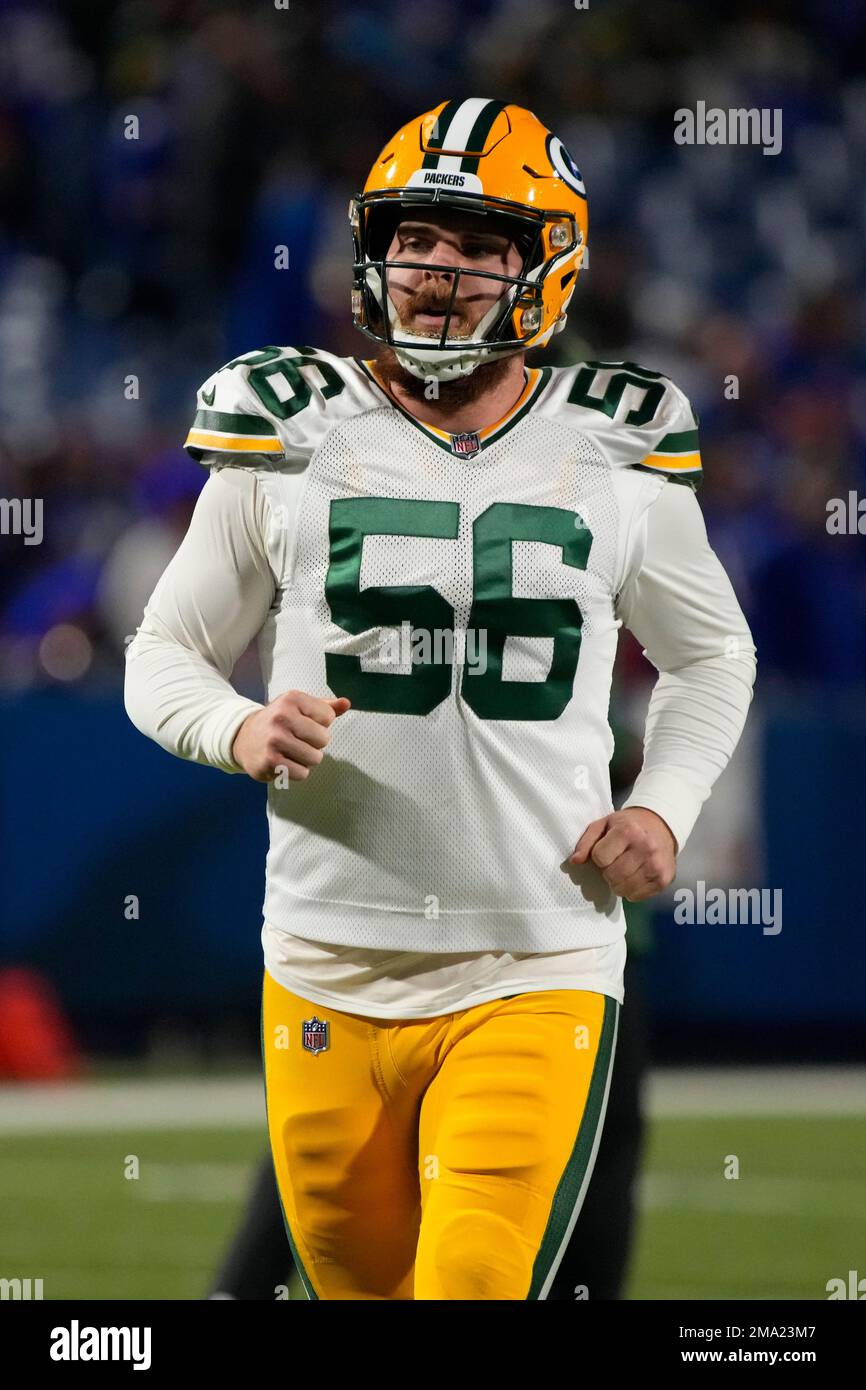 Green Bay Packers' Jack Coco rides a bike to NFL football training