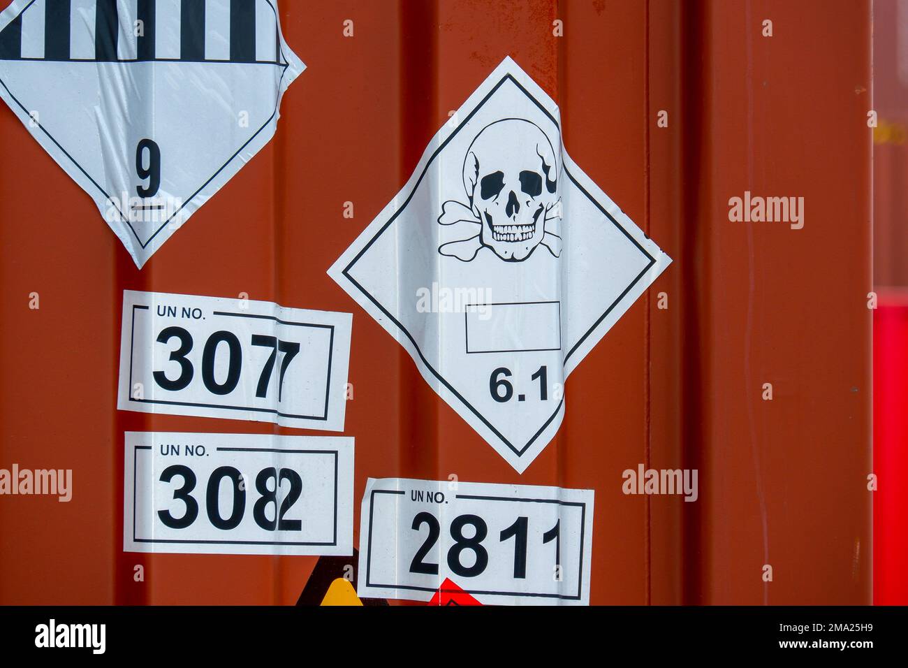 Dangerous stickers attached to containers Stock Photo