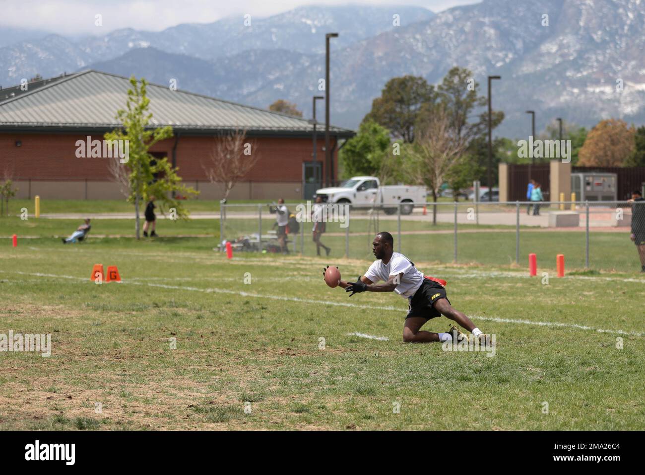 Sgt. Daimone L. Walker, a supply specialist, assigned to the 2nd General Support Aviation Battalion, 4th Combat Aviation Brigade, 4th Infantry Division makes an interception after two back to back deflections during a flag football game during Ivy Week 2022, May 23, 2022, Fort Carson, Colorado.  Fort Carson hosts Ivy Week to celebrate the 4th Inf. Div.'s history, team spirit and support of one another. Stock Photo