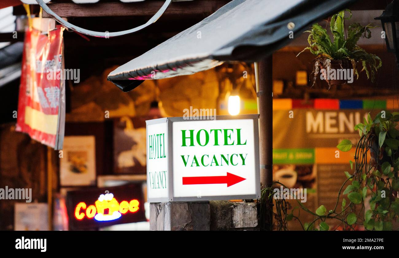Sign in front of a hotel indicating there is a vacancy. Stock Photo