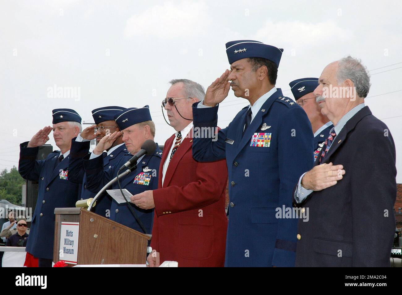 040718-F-4563N-028. [Complete] Scene Caption: These distinguished guests (Left to Right): Ohio Air National Guard (OHANG) Brigadier General (BGEN) Richard Green, Assistant Adjutant General (AG) for Air and Commander, OHANG; US Air Force (USAF) BGEN Vergel Lattimore, Chaplain and Air National Guard (ANG) assistant to the Air Force CHIEF of Chaplains; OHANG Major General (MGEN) John Smith, AG Ohio National Guard, Joint Force Headquarters (JF HQ); Mr. Jan Maroscher (singing the US National Anthem); USAF Lieutenant General (LGEN) Daniel James, III, Director of the US ANG; USAF (ret.) Colonel (COL) Stock Photo