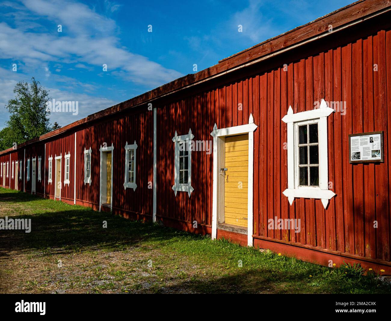 A view traditional Swedish red houses. The color, known as Falu red, has been a symbol of pastoral life in for the last century. Nordic countries all boast