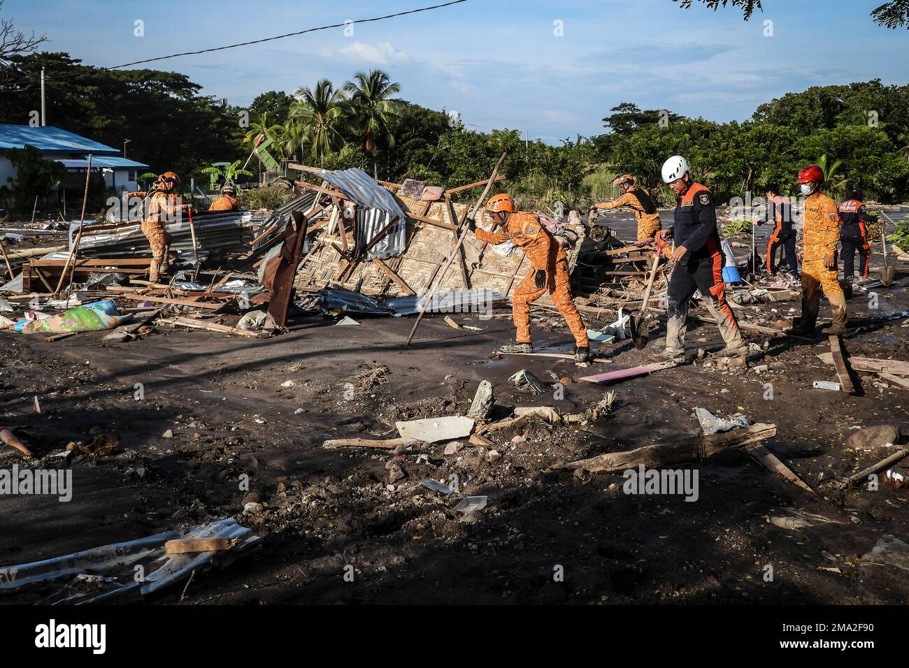Rescuers search for missing bodies in a mudslide after Tropical Storm ...