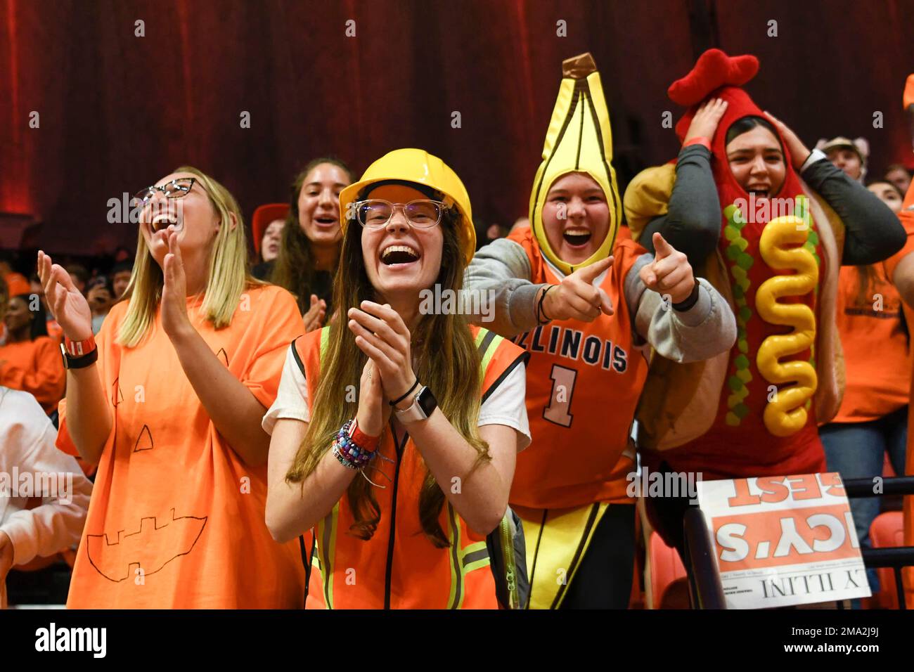 Illinois fans dressed in halloween costumes cheer before the start of