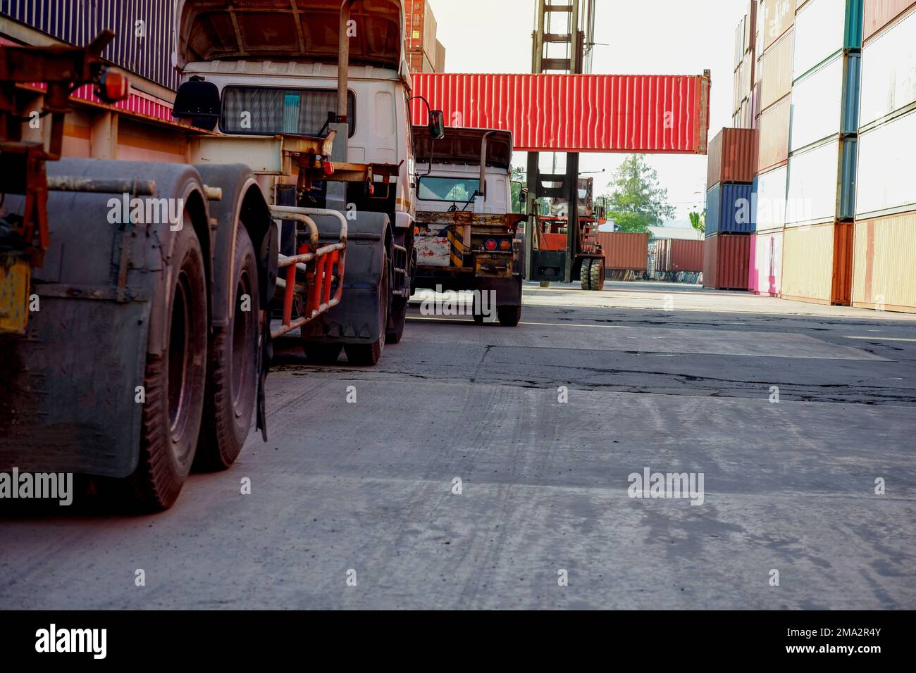 Trucks in the container depot Focus on imports and exports Stock Photo