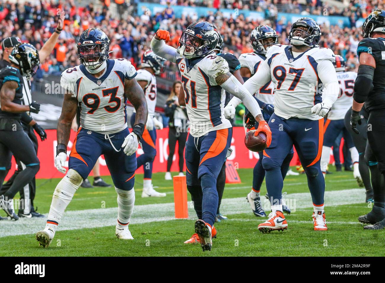 DENVER, CO - DECEMBER 11: Denver Broncos defensive end Dre'Mont Jones (93)  runs onto the field during starting lineup introductions before a game  between the Kansas City Chiefs and the Denver Broncos