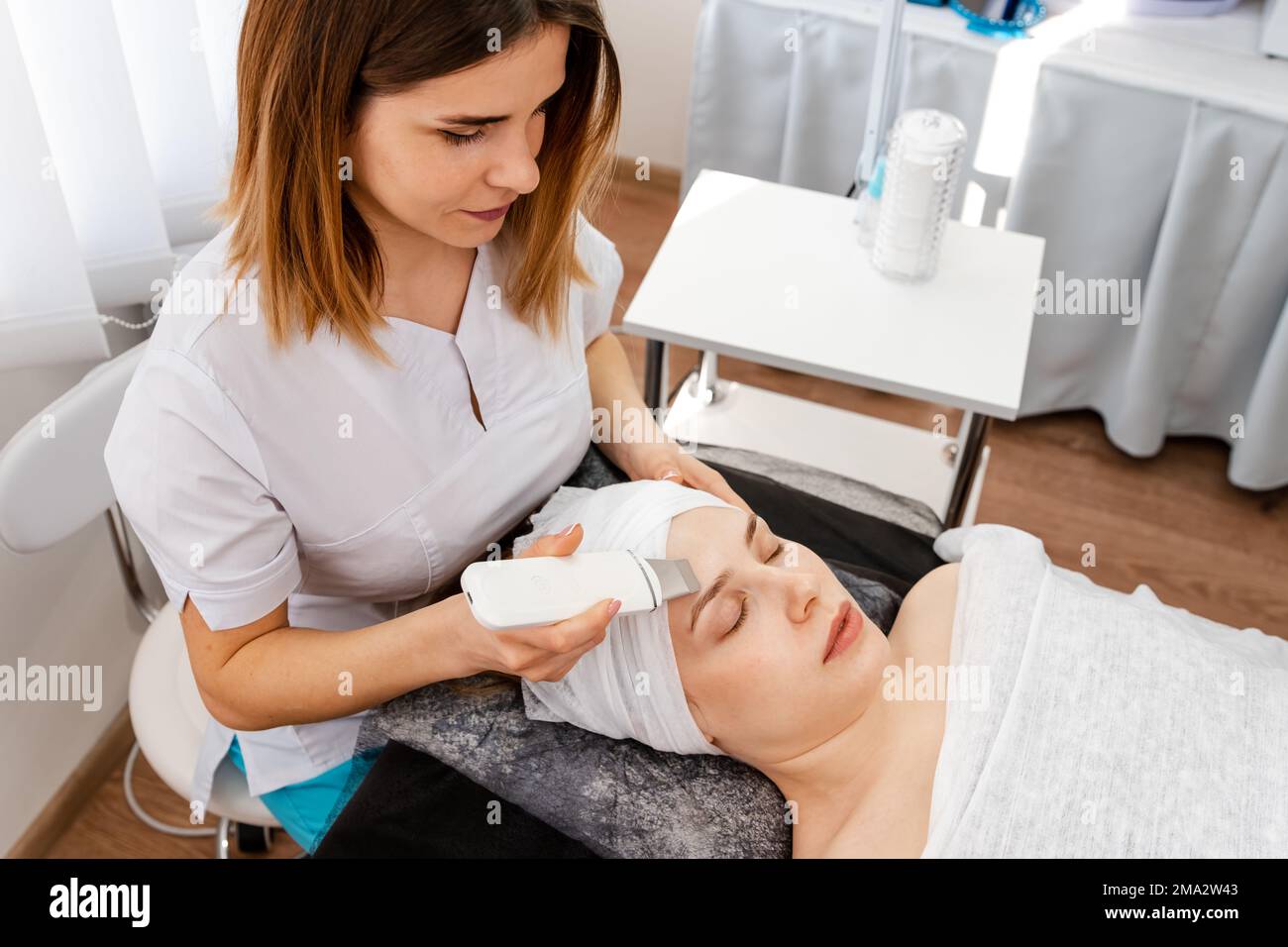 Woman getting ultrasound face hi-res stock photography and images - Alamy