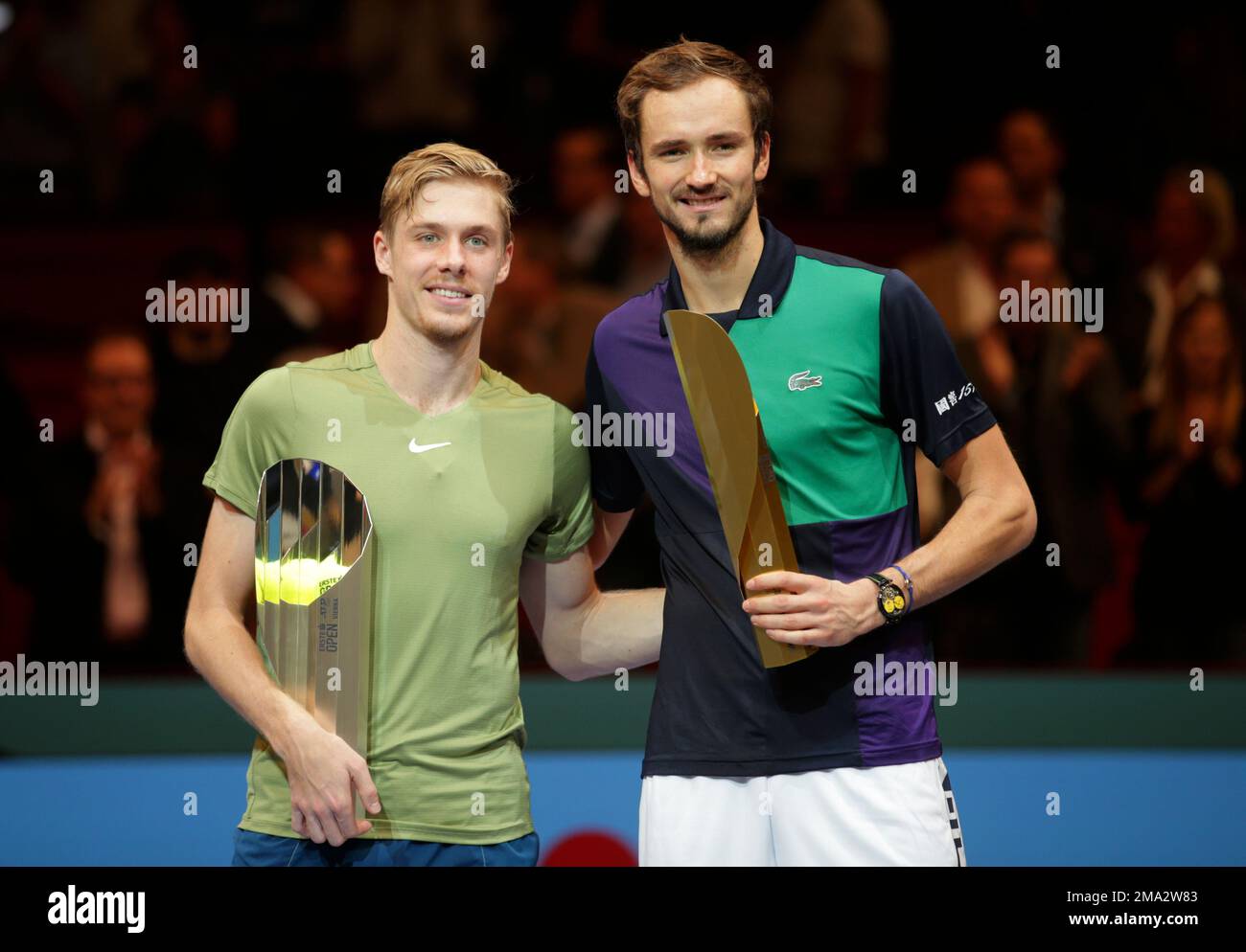 Daniil Medvedev of Russia, right, poses after winning the final