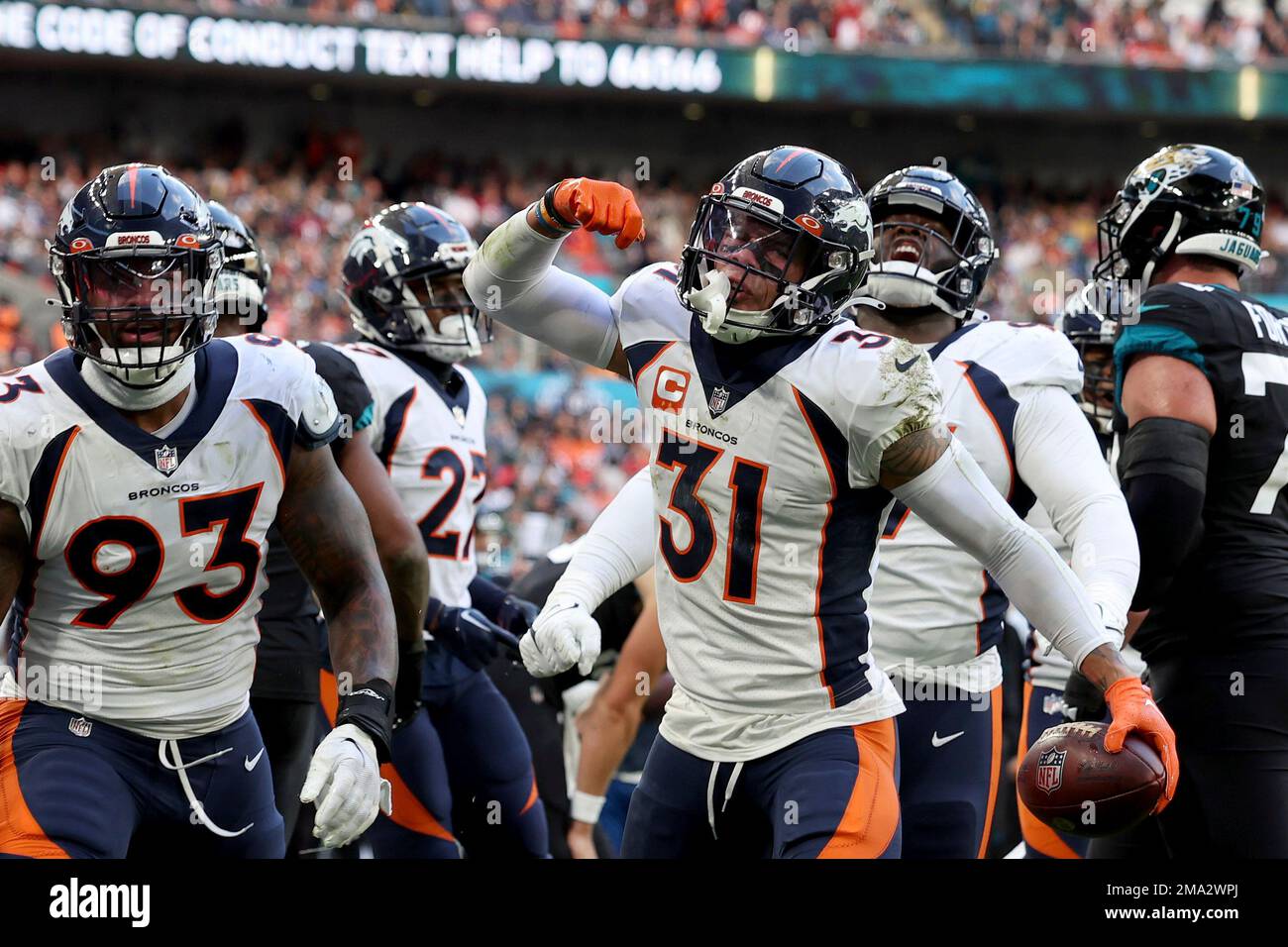 Denver Broncos players react during the NFL football game between