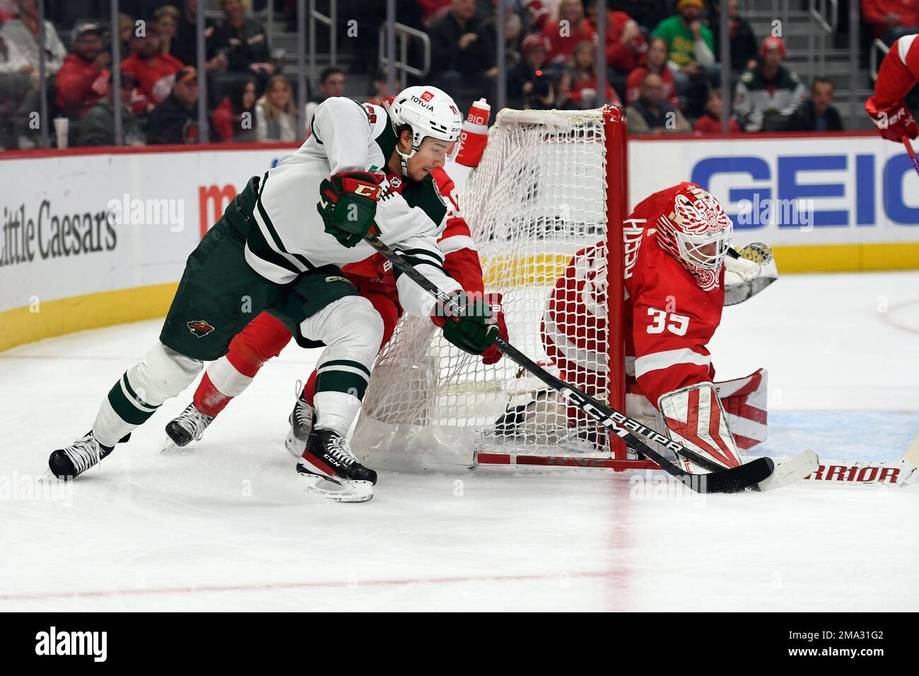 Detroit Red Wings goaltender Ville Husso, right, blocks the shot of ...