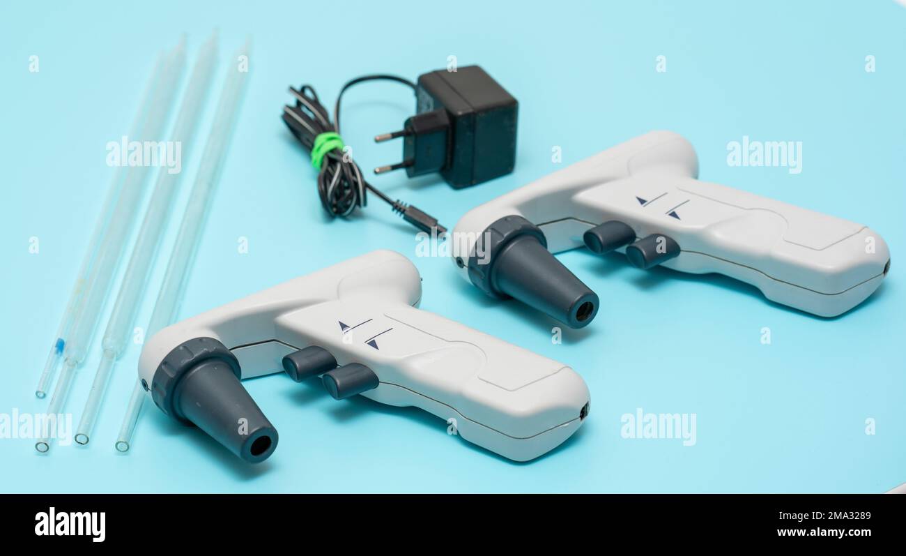 automatic electric pipette for scientific laboratory Stock Photo Alamy