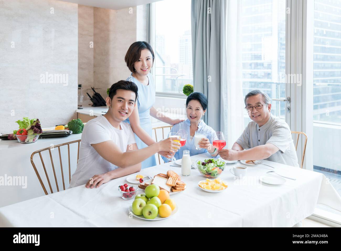 Happy family in the kitchen to have breakfast Stock Photo