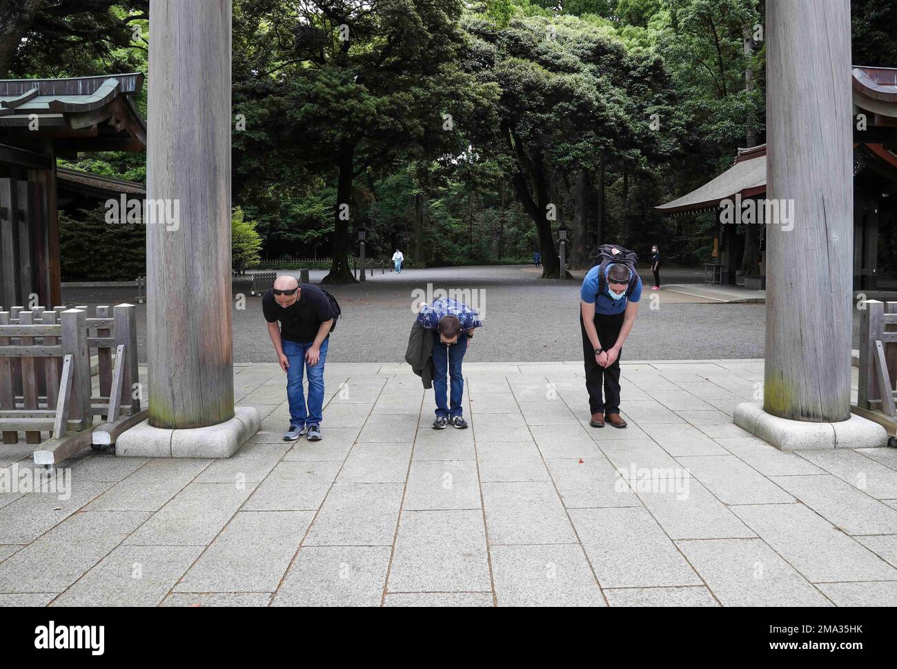 TOKYO (May 24, 2022) Sailors, assigned to the Nimitz-class aircraft carrier USS Abraham Lincoln (CVN 72), bow before entering the Meiji Shrine in Tokyo during a Morale, Welfare and Recreation (MWR) tour. Abraham Lincoln Strike Group is on a scheduled deployment in the U.S. 7th Fleet area of operations to enhance interoperability through alliances and partnerships while serving as a ready-response force in support of a free and open Indo-Pacific region. Stock Photo