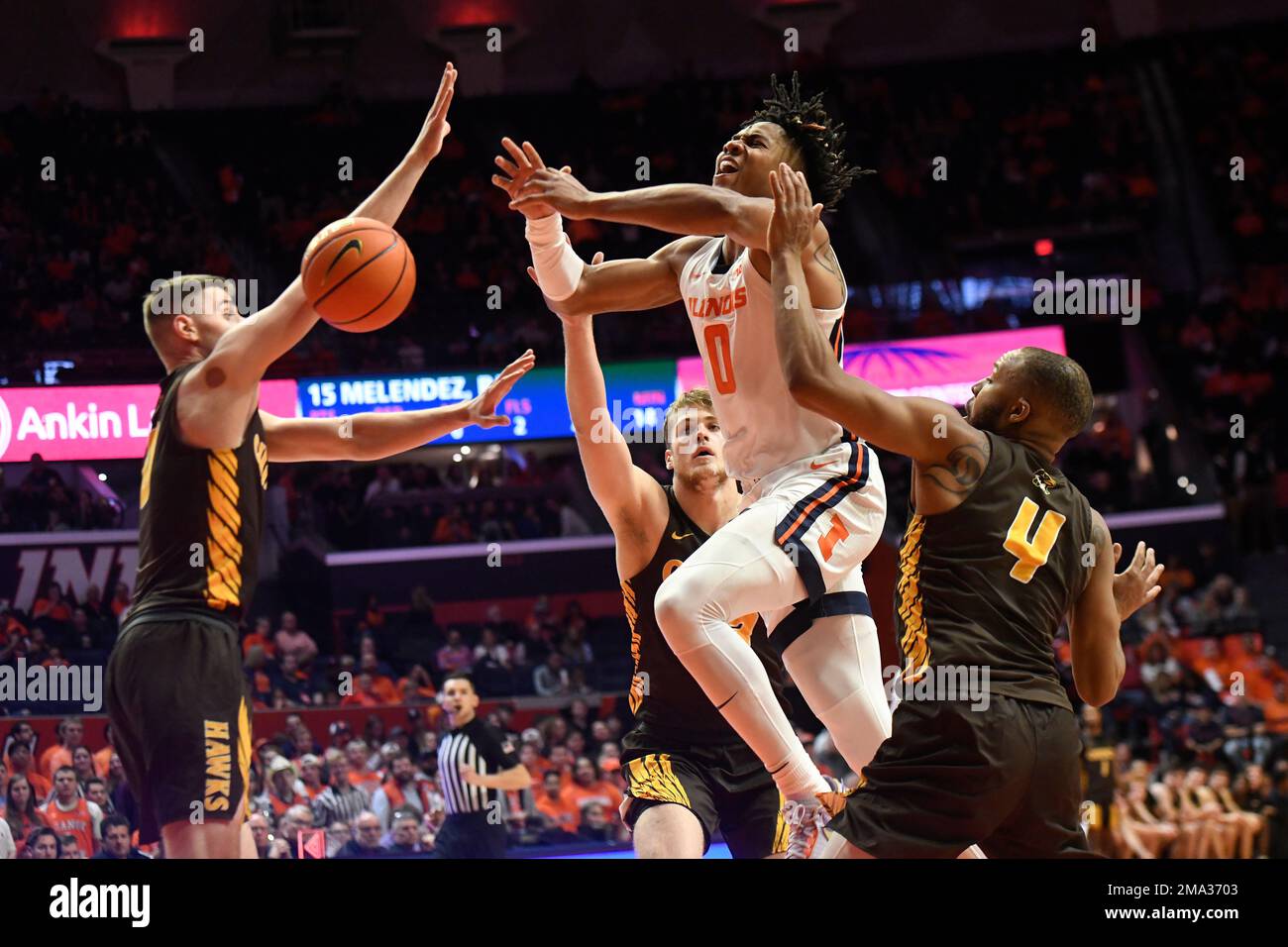 Illinois' Terrence Shannon Jr. (0) loses the ball as Quincy's Jamaurie Coakley (4), Paul Zilinskas, left, and Mason Wujek defend during the second half of an NCAA college basketball game Friday, Oct. 28, 2022, in Champaign, Ill. (AP Photo/Michael Allio) Stock Photo