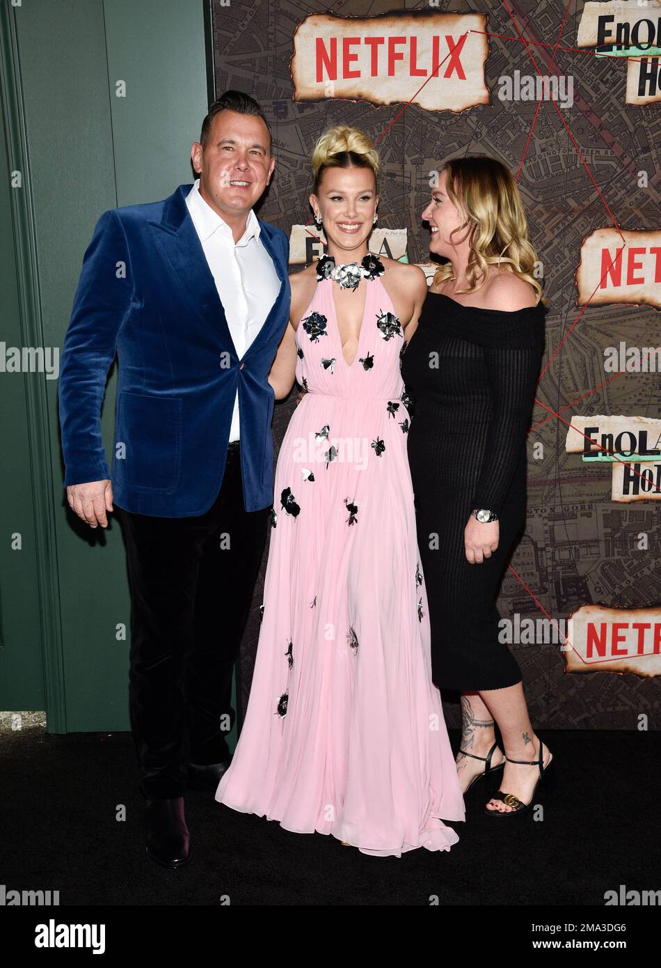 Millie Bobby Brown, center, poses with her father Robert Brown, left
