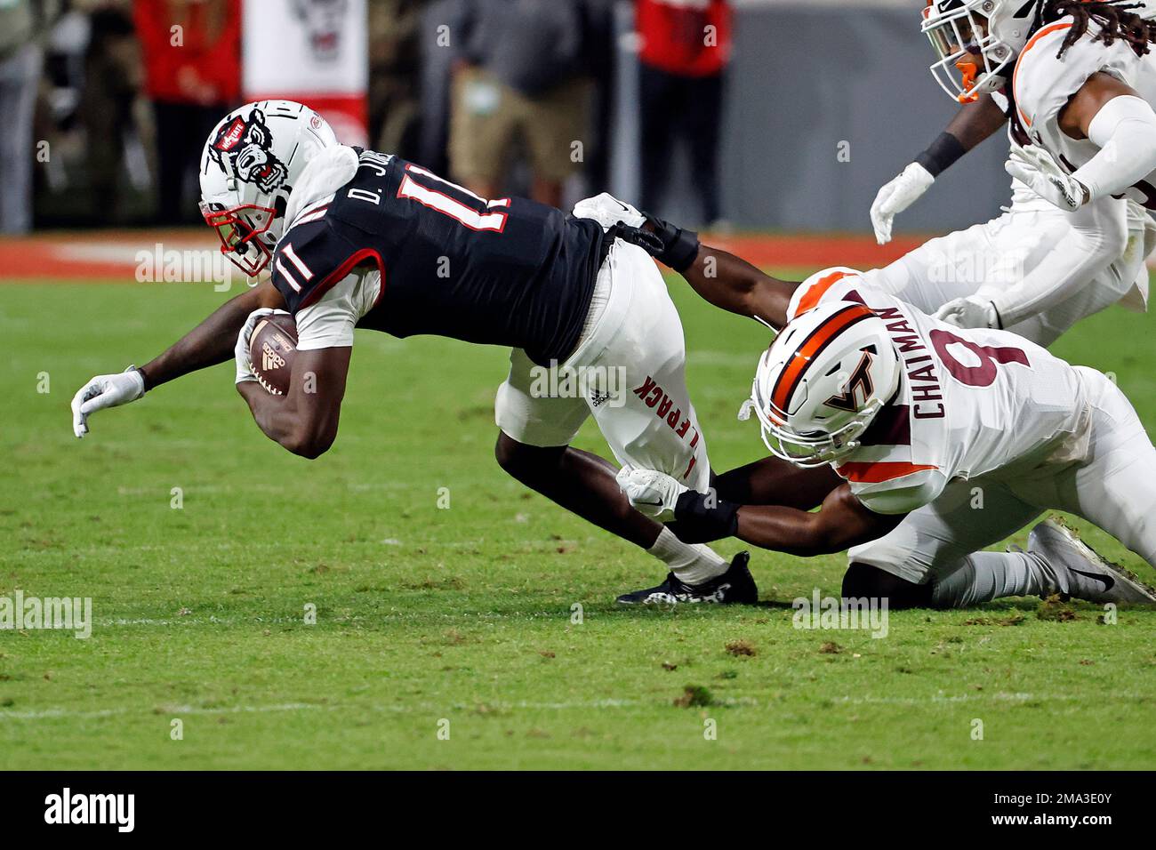 North Carolina State s Darryl Jones 11 tries to break the tackle