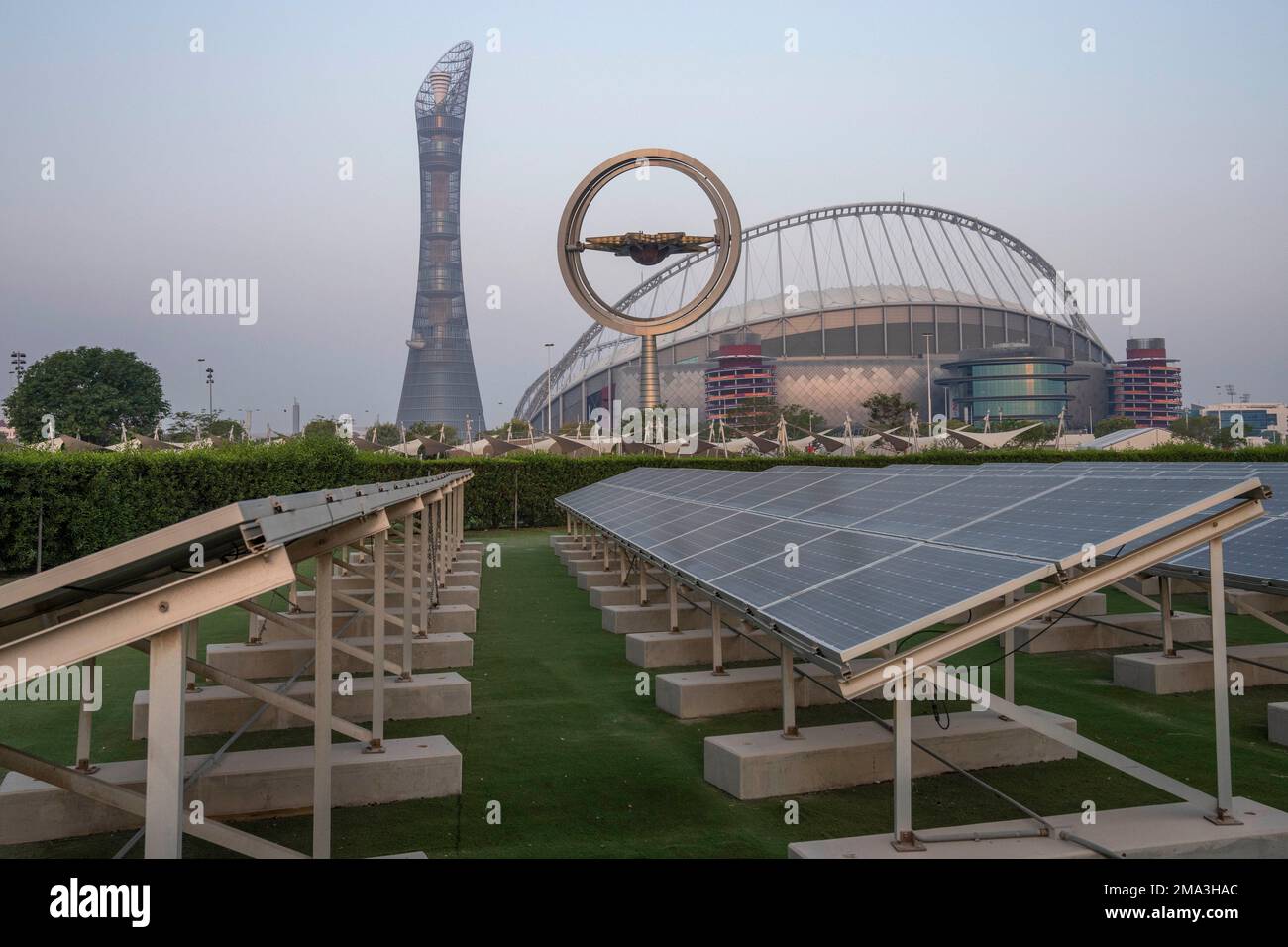 Solar panels sit in front of Khalifa International Stadium, also known as Qatar's National and oldest Stadium, which will host matches during FIFA World Cup 2022, in Doha, Qatar, Saturday, Oct. 15, 2022. (AP Photo/Nariman El-Mofty) Stock Photo