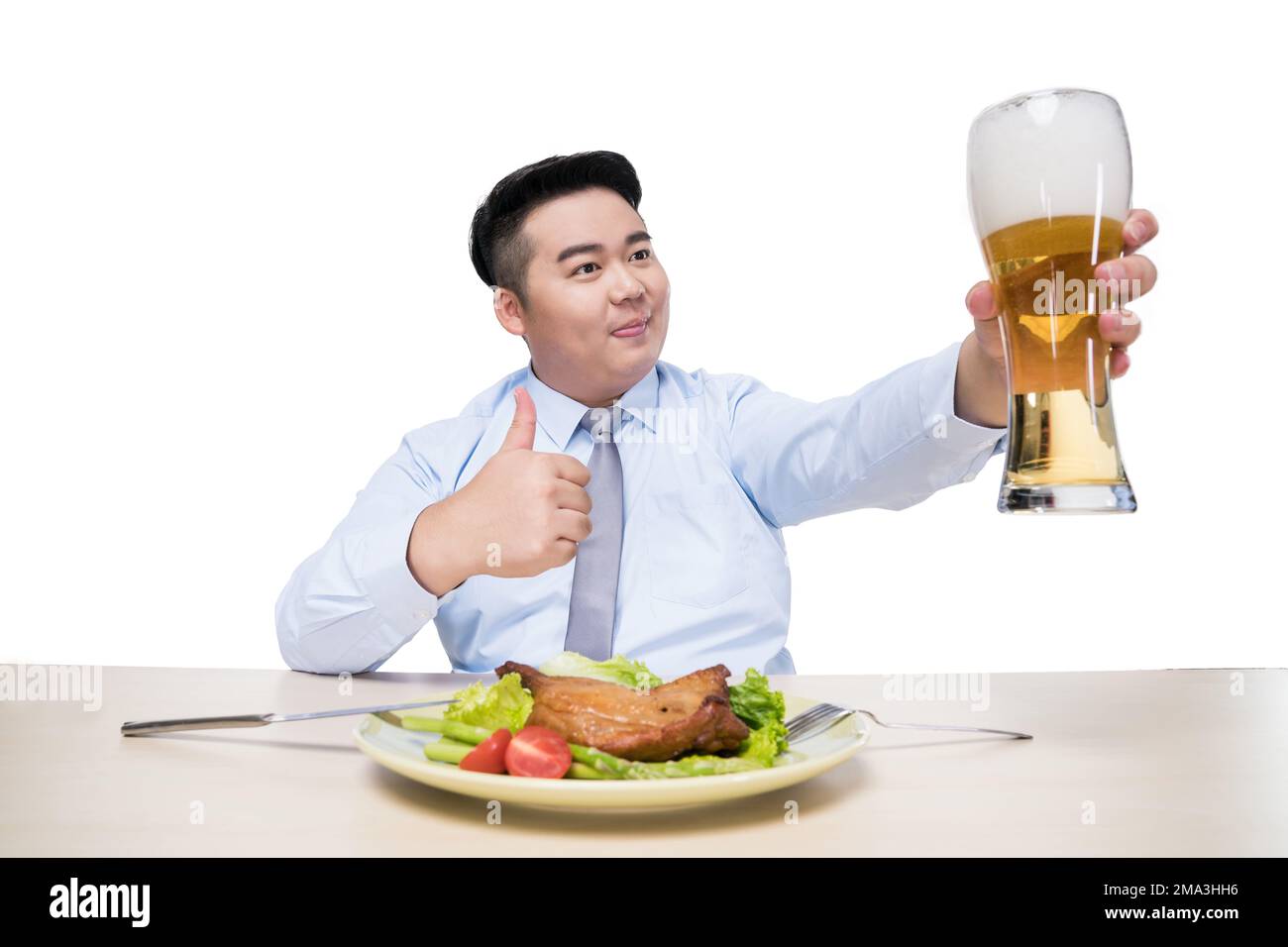 Fat man drinking beer at dinner Stock Photo Alamy