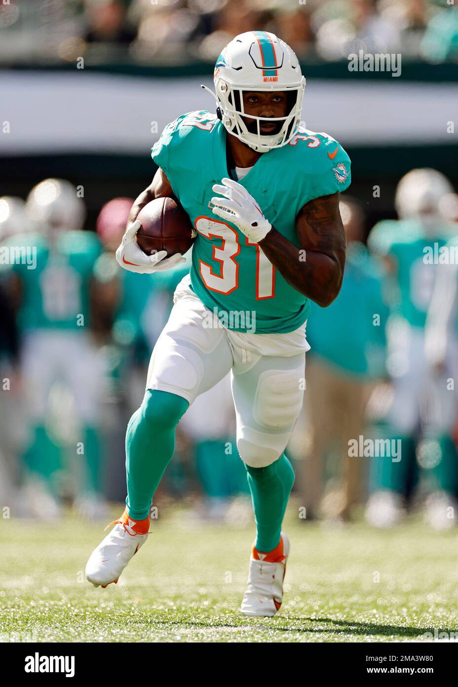 Miami Dolphins running back Raheem Mostert (31) runs with the ball