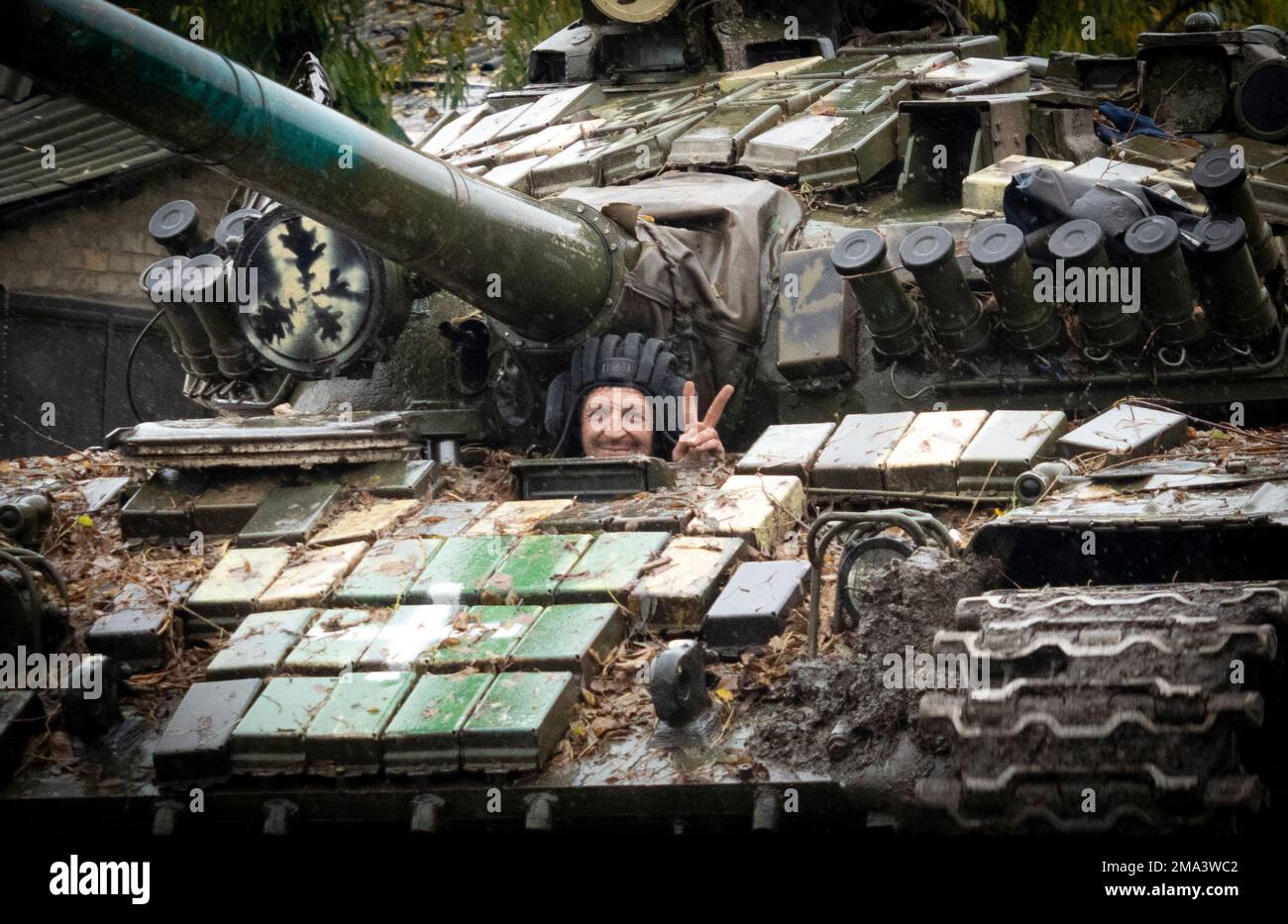 Ukrainian soldier flashes a victory sign in Bakhmut, the site of the ...