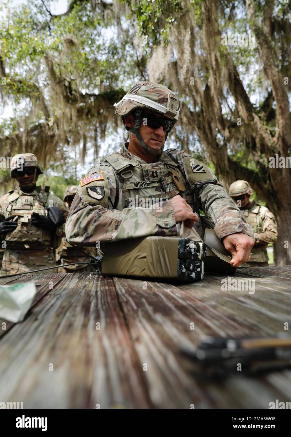 Capt. Joshua Moore, the commander of the 24th Ordnance Company, 87th Division Sustainment Support Battalion, 3rd Division Sustainment Brigade, demonstrates how to set up a block of C-4 during a demolition leader professional development range at Fort Stewart, Georgia, May 24, 2022. The training event was held to teach leaders throughout the battalion to safely employ C-4 in hasty or deliberate demolitions at an ammunition supply point. (U.S. Army photos by Sgt. Aaliyah Craven, 50th Public Affairs Detachment) Stock Photo