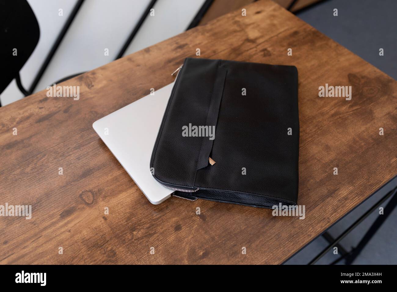 leather folder laptop case on the table Stock Photo
