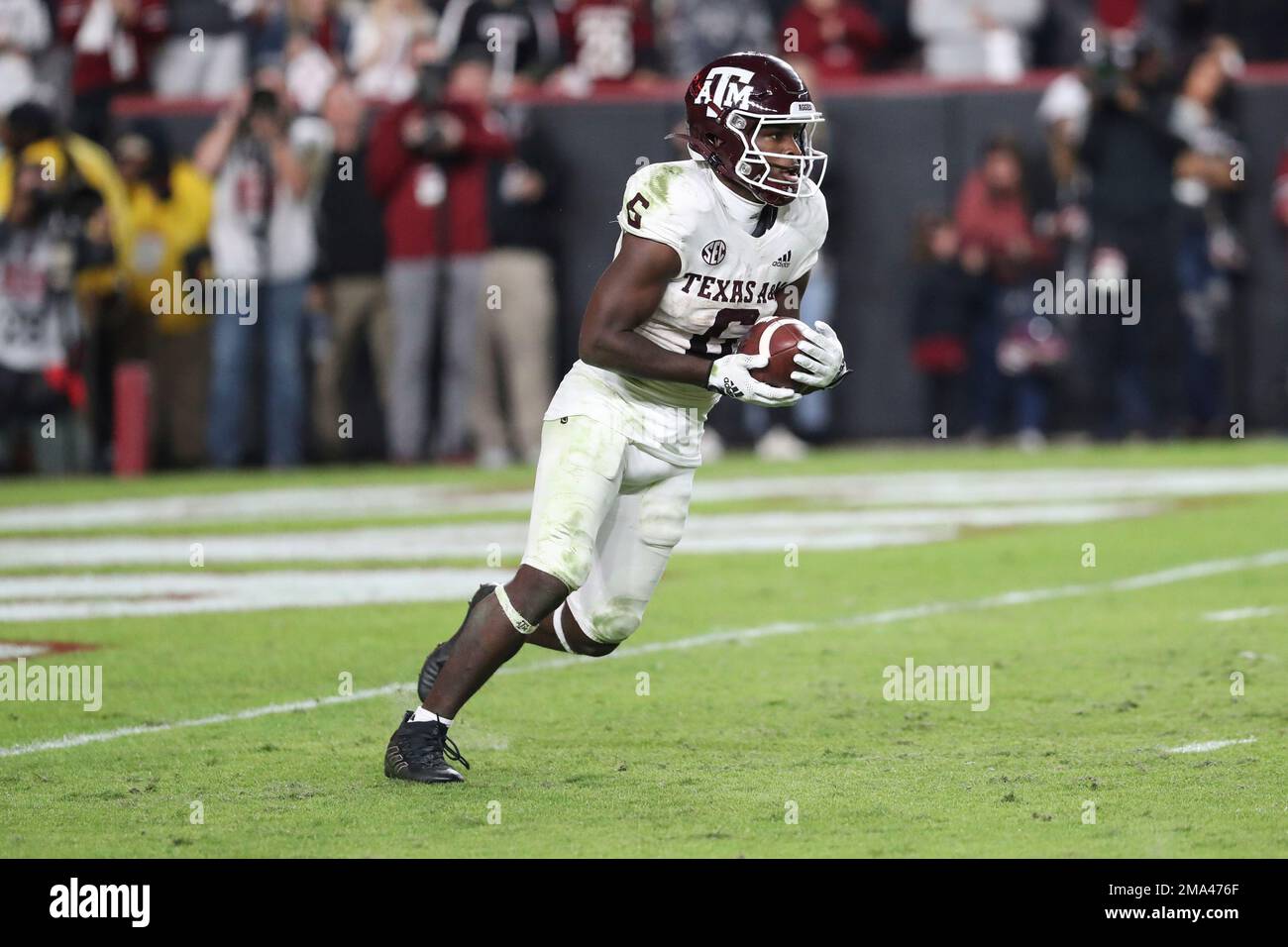 Texas A&M running back Devon Achane (6) returns a kickoff during an NCAA college football game