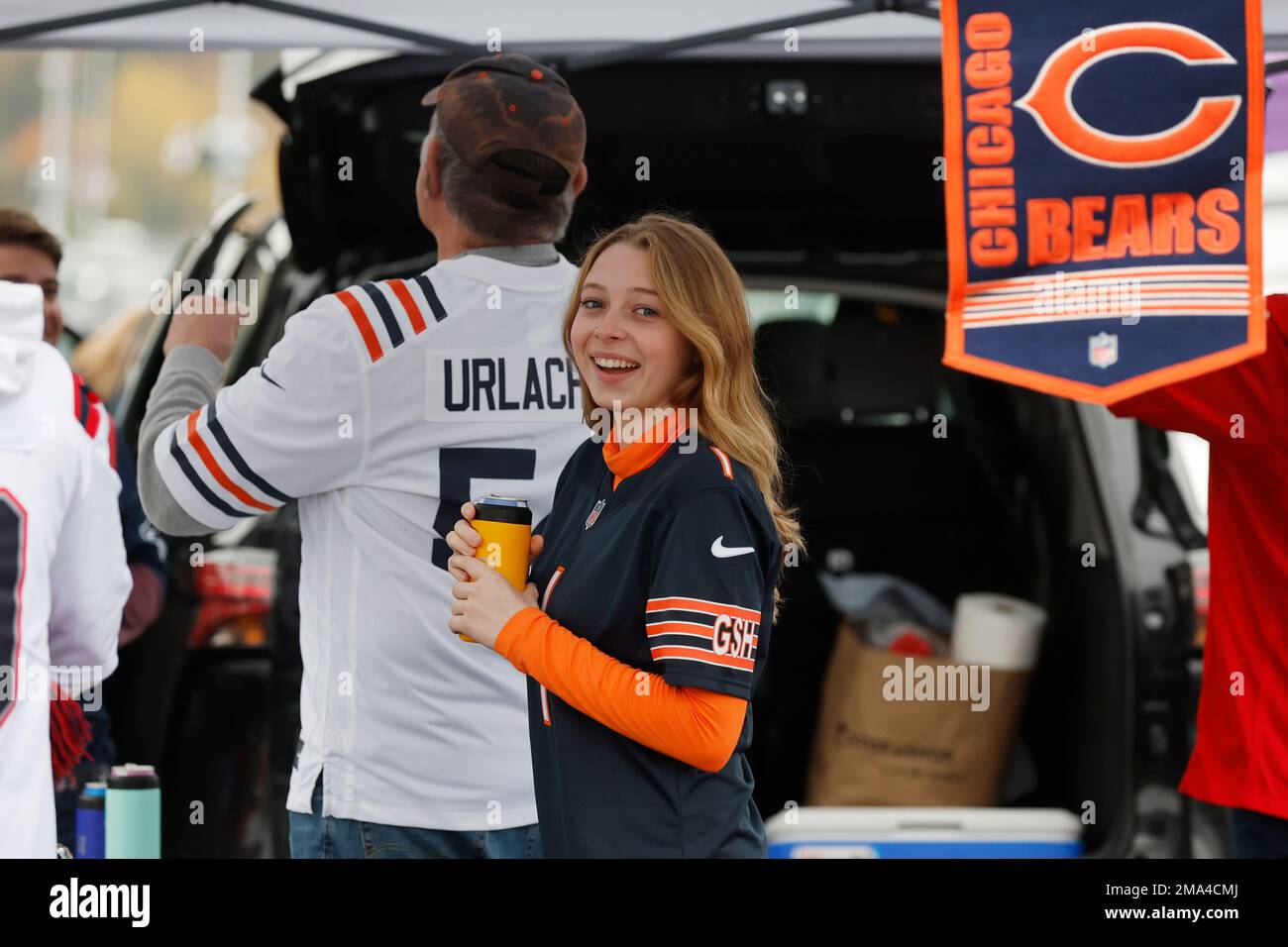 Fans tailgate in the parking lot of Gillette Stadium prior to an NFL