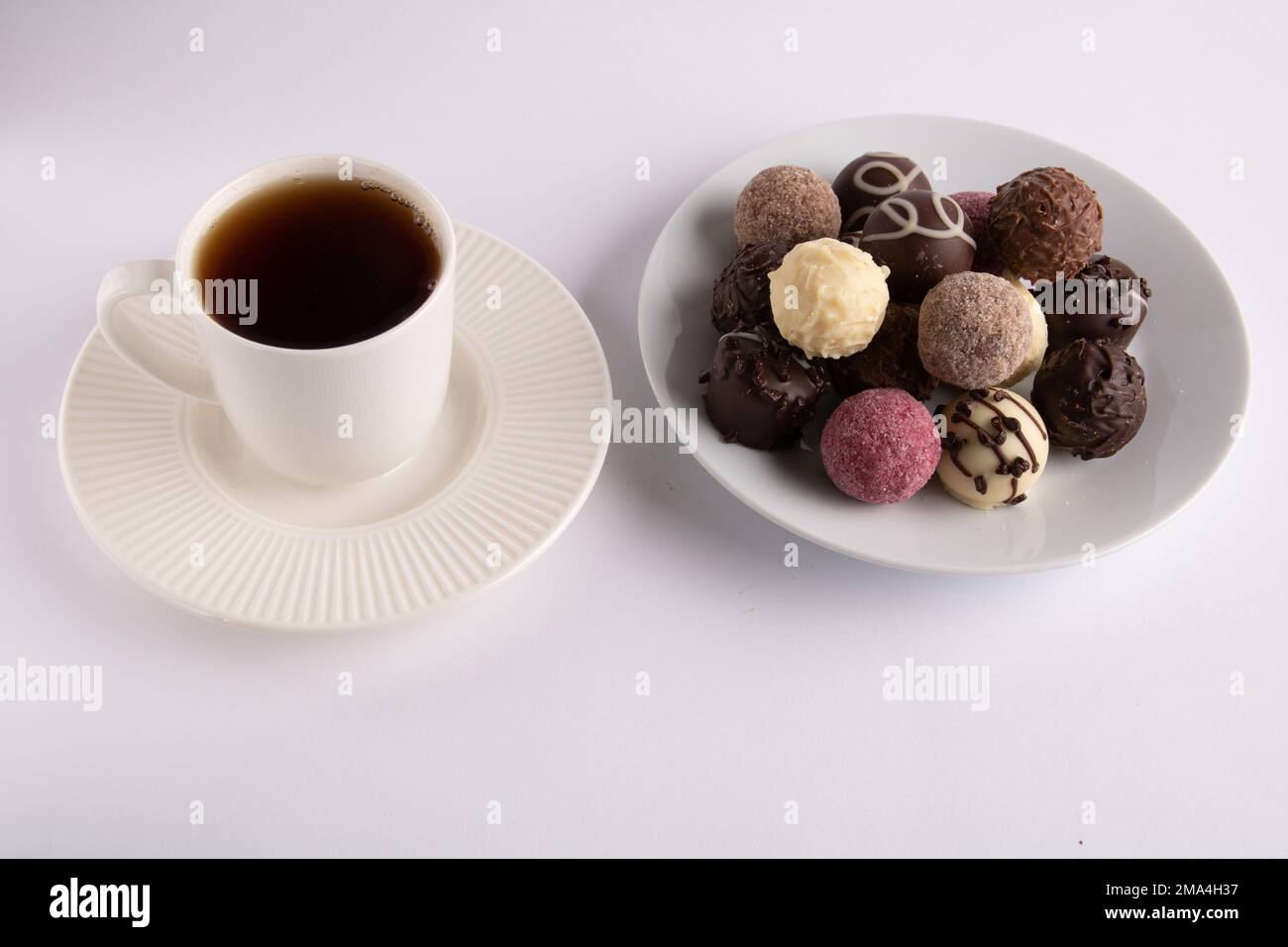 photo of coffee and candy on a white background Stock Photo Alamy