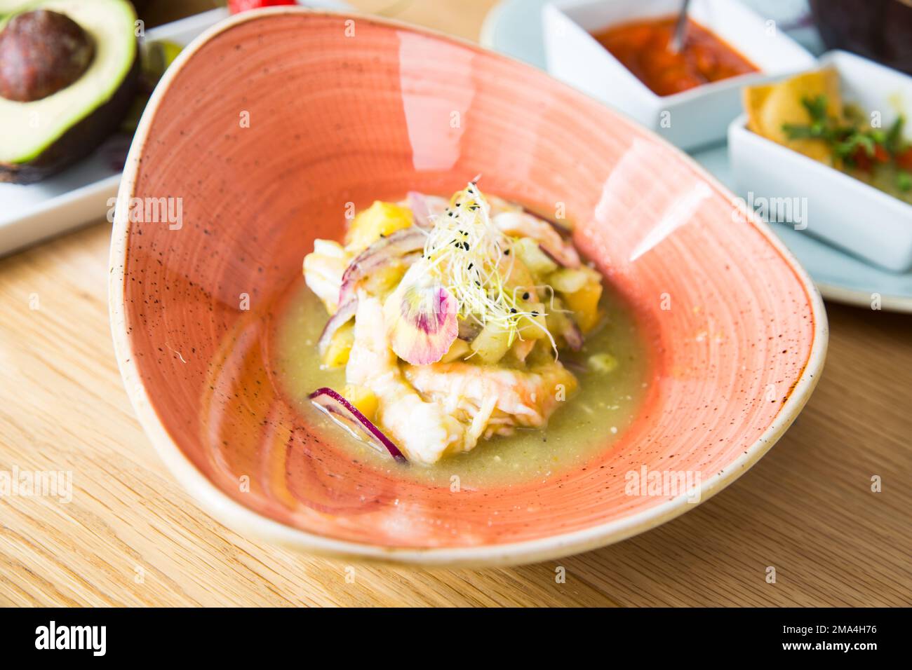 Sea bass ceviche. The cebiche or ceviche is a dish consisting of fish marinated in citrus seasonings. Stock Photo