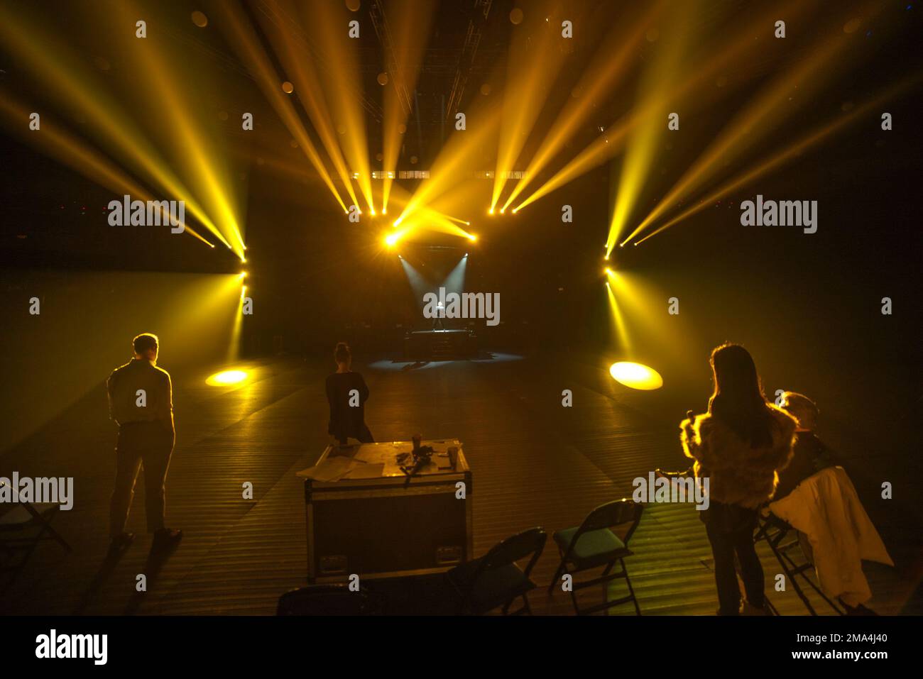 artist on stage in the rays of light Stock Photo - Alamy