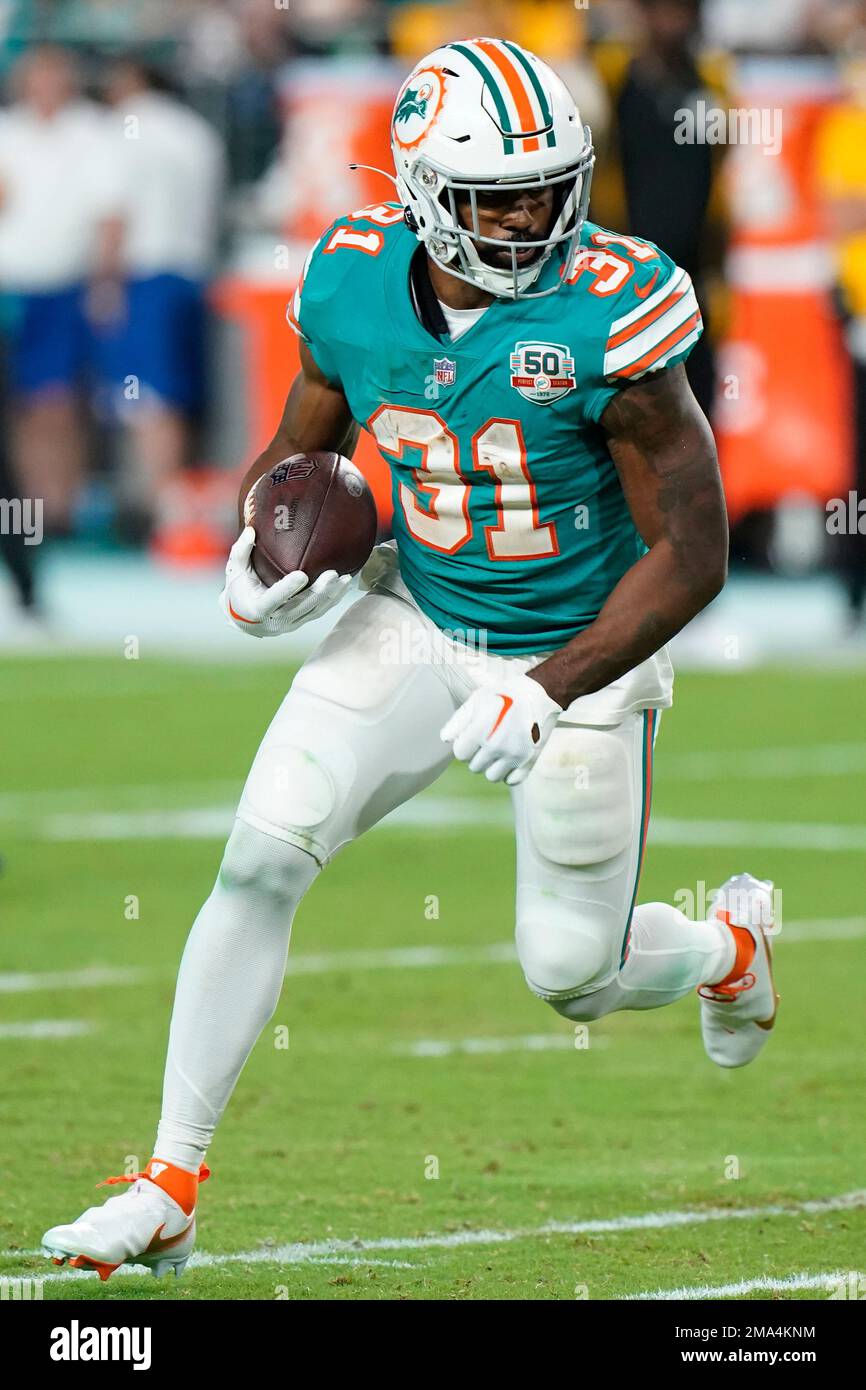 Miami Dolphins running back Raheem Mostert (31) runs a play during the