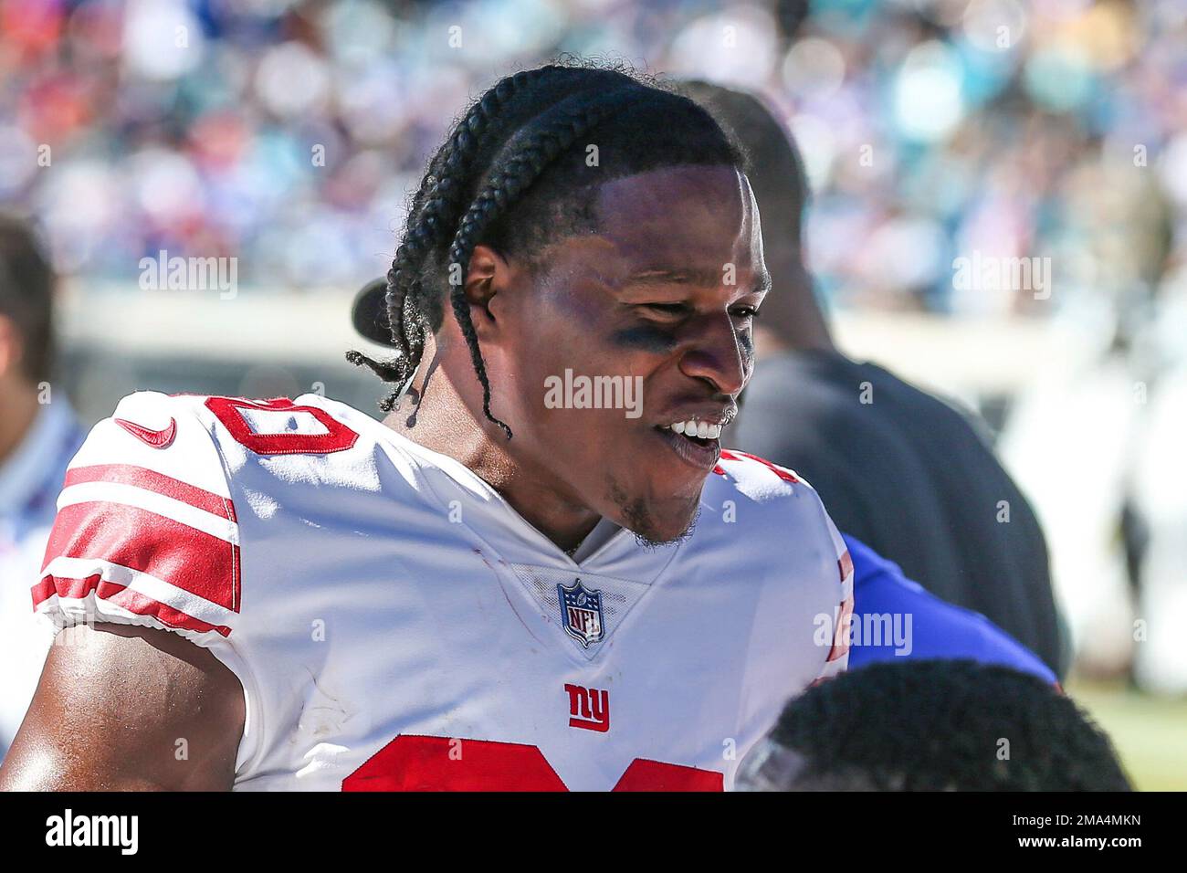 New York Giants cornerback Darnay Holmes (30) talks with teammates on