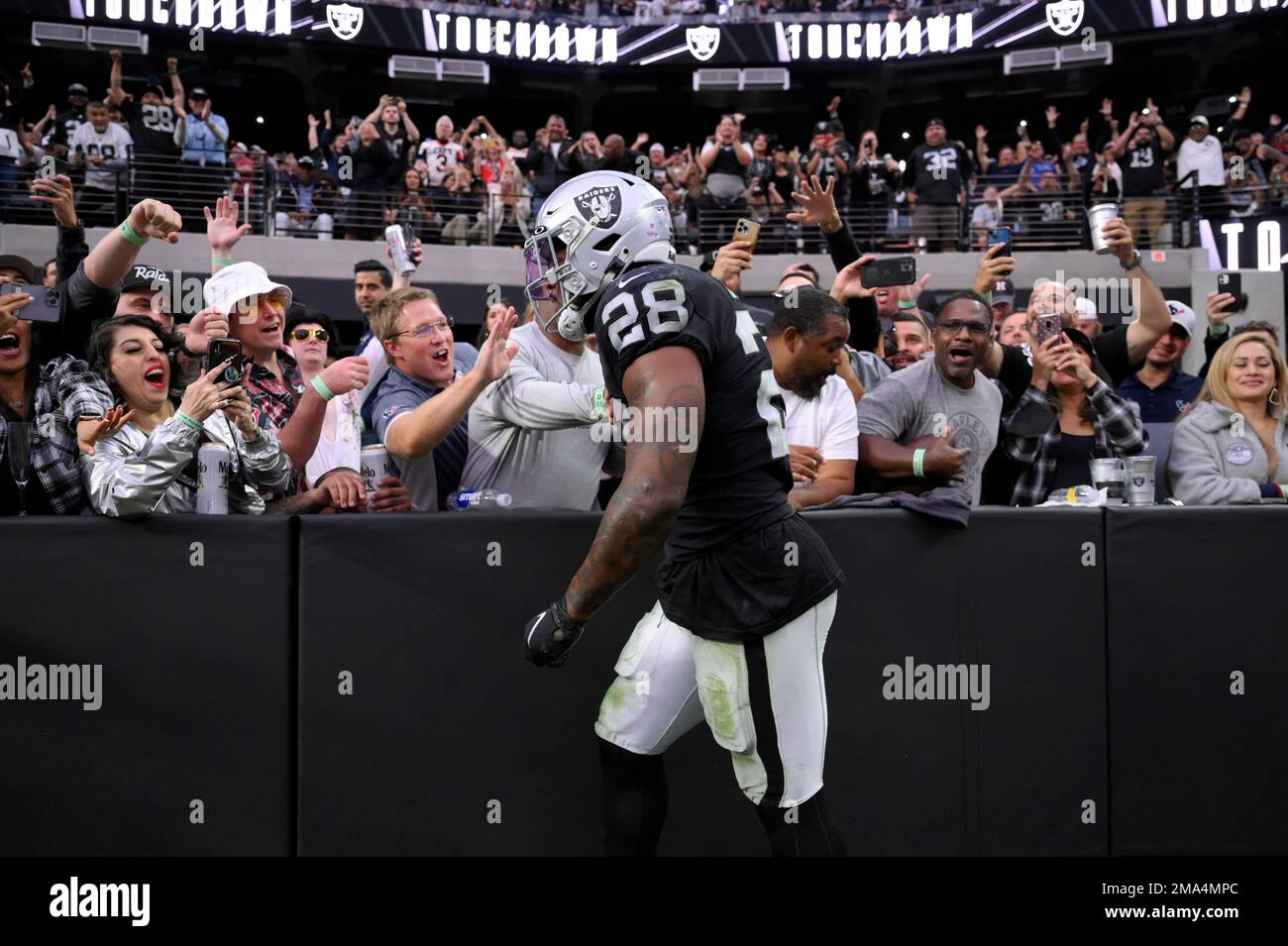 Las Vegas Raiders running back Josh Jacobs reacts with fans after a  touchdown during the second half of an NFL football game against the  Houston Texans Sunday, Oct. 23, 2022, in Las