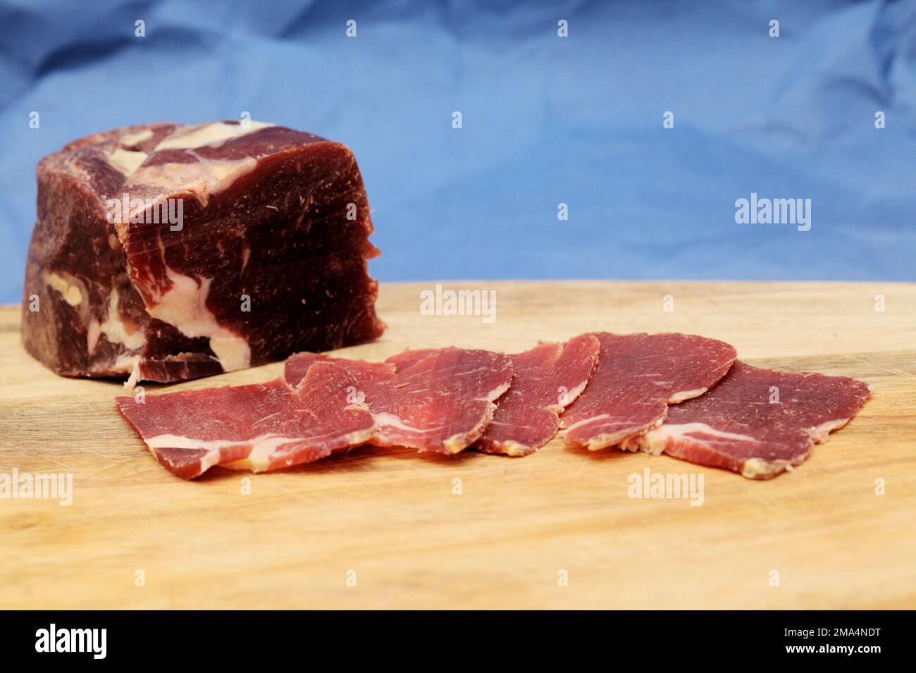 A piece of cecina from Leon (air dried and smoked cured beef made from the  hind leg of cattle from León, Spain Stock Photo - Alamy