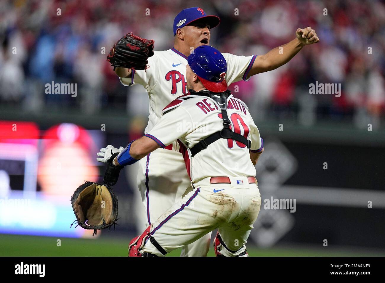 Philadelphia Phillies starting pitcher Ranger Suarez and catcher J.T.  Realmuto celebrate after winning the baseball NL Championship Series  against the San Diego Padres on Sunday, Oct. 23, 2022, in Philadelphia. (AP  Photo/Brynn