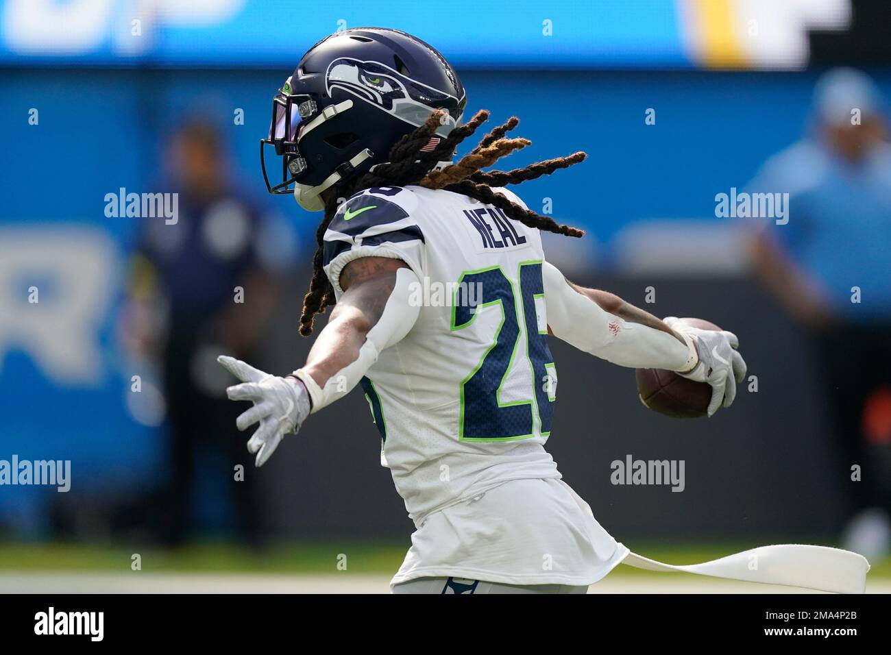 Seattle Seahawks safety Ryan Neal (26) celebrates after a play during the  first half of an NFL football game against the Los Angeles Chargers Sunday,  Oct. 23, 2022, in Inglewood, Calif. (AP