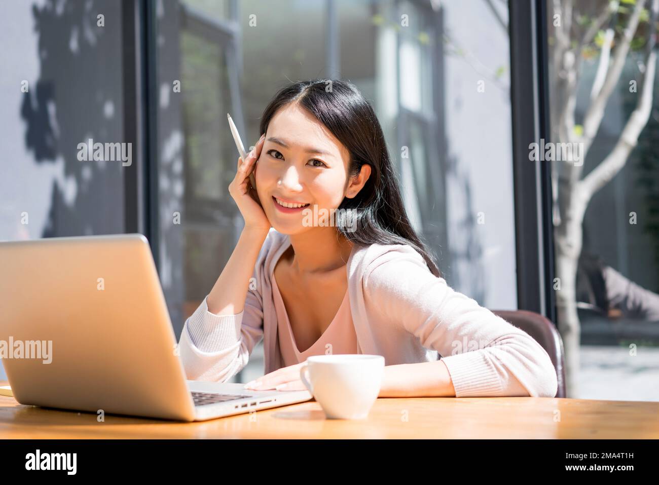 A young woman use the computer Stock Photo - Alamy